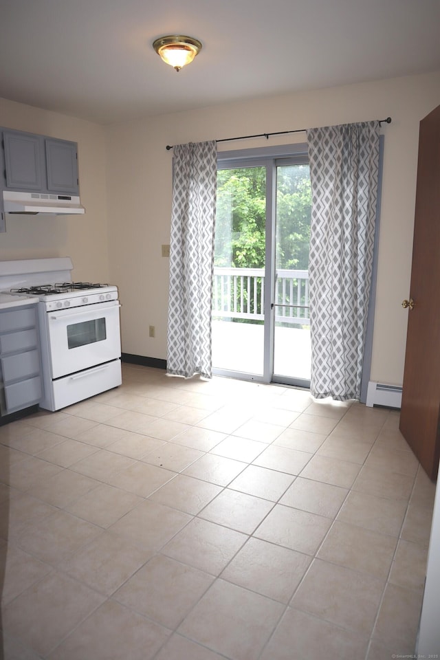 155 Jackson St, Ansonia, CT 06401 - kitchen featuring white range with gas cooktop, a baseboard heating unit, under cabinet range hood, and light tile patterned floors