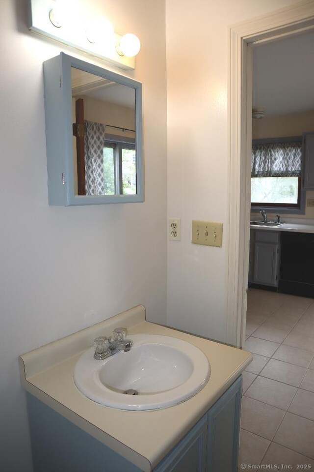 155 Jackson St, Ansonia, CT 06401 - bathroom with vanity, tile patterned flooring, and healthy amount of natural light