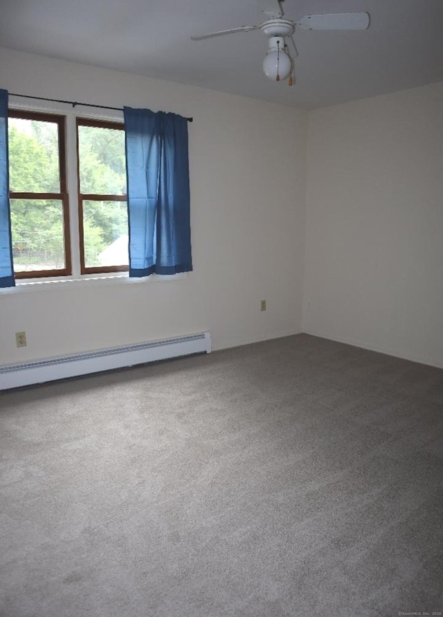 155 Jackson St, Ansonia, CT 06401 - spare room with a baseboard heating unit, carpet floors, and a ceiling fan