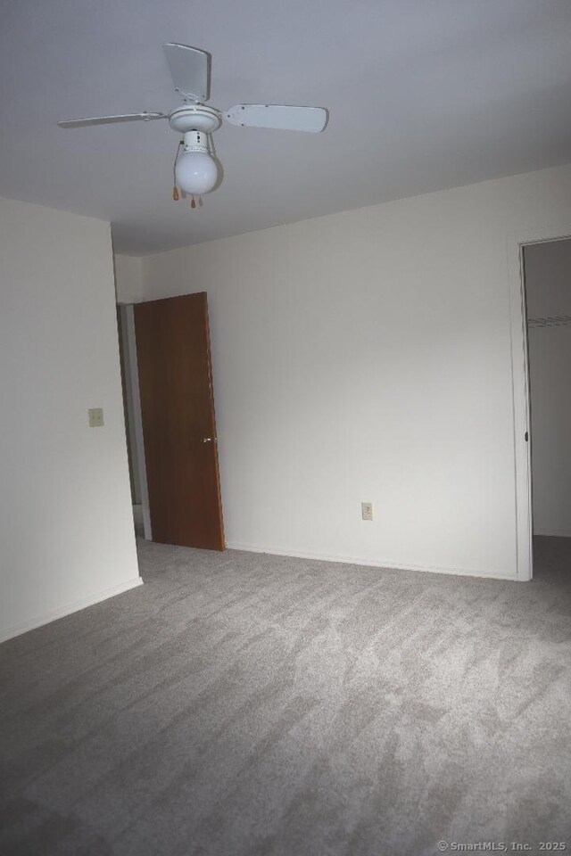 155 Jackson St, Ansonia, CT 06401 - unfurnished room featuring carpet flooring, a ceiling fan, and baseboards