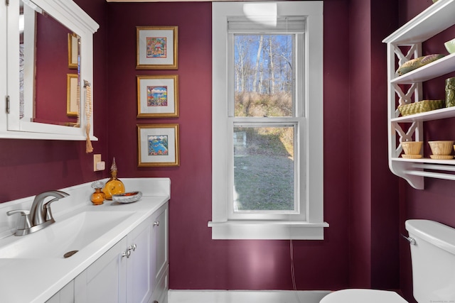 70 River Rd, East Haddam, CT 06423 - half bath with toilet, vanity, and healthy amount of natural light
