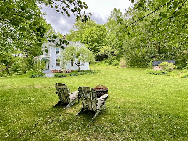 70 River Rd, East Haddam, CT 06423 - view of grassy yard featuring a fire pit