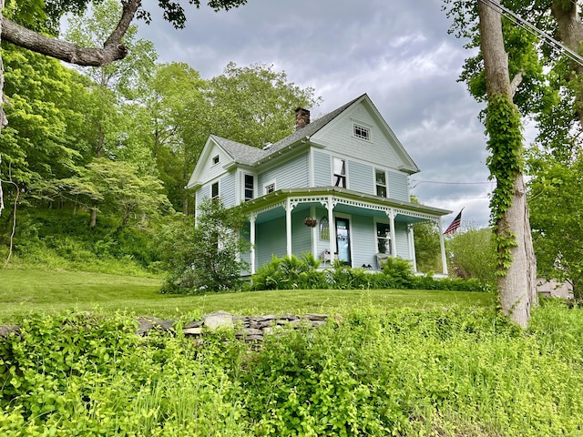 70 River Rd, East Haddam, CT 06423 - victorian-style house with a chimney, a front lawn, a porch, and roof with shingles