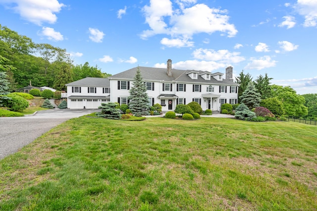 184 Fern Ave, Litchfield, CT 06759 - view of front of home featuring an attached garage, driveway, and a chimney