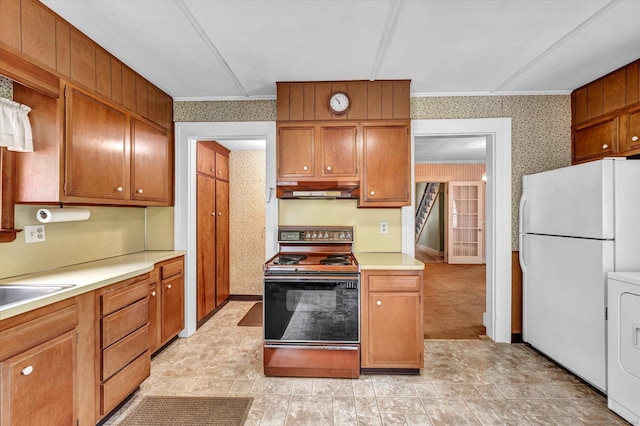44 Maple Ave, Canton, CT 06019 - kitchen with electric range, freestanding refrigerator, wallpapered walls, washer / dryer, and light countertops