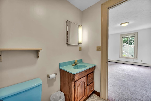 44 Maple Ave, Canton, CT 06019 - half bath with toilet, vanity, and a baseboard heating unit