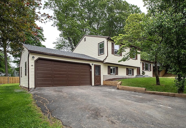 179 Anns Farm Rd, Hamden, CT 06518 - split level home featuring asphalt driveway and an attached garage