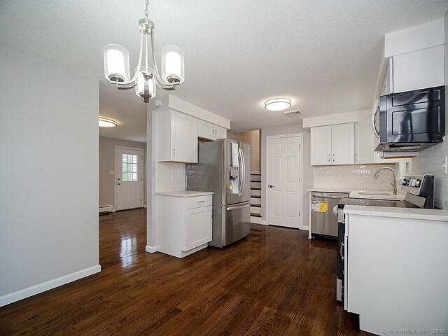 179 Anns Farm Rd, Hamden, CT 06518 - kitchen featuring appliances with stainless steel finishes, light countertops, white cabinets, and a textured ceiling