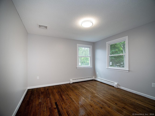 179 Anns Farm Rd, Hamden, CT 06518 - unfurnished room featuring dark wood-style flooring, baseboards, a textured ceiling, and a baseboard heating unit