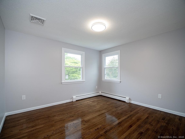 179 Anns Farm Rd, Hamden, CT 06518 - unfurnished room with dark wood-type flooring, baseboards, a baseboard radiator, and a textured ceiling