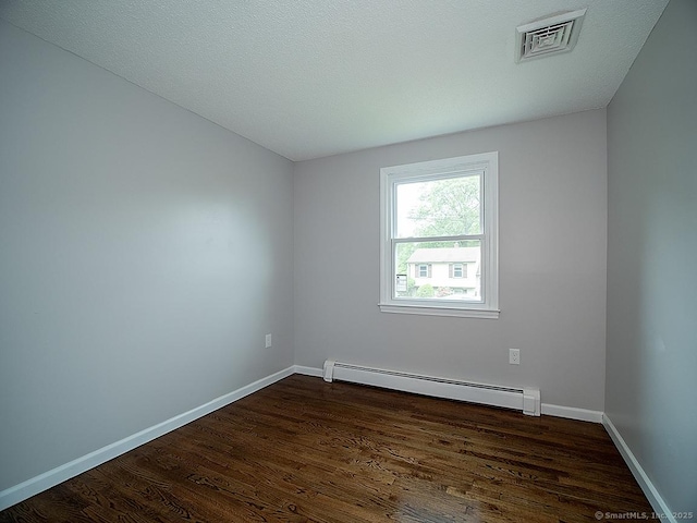 179 Anns Farm Rd, Hamden, CT 06518 - spare room with a baseboard radiator, dark wood-style floors, and baseboards