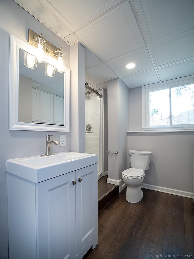 179 Anns Farm Rd, Hamden, CT 06518 - full bathroom featuring wood finished floors, vanity, toilet, baseboards, and a shower