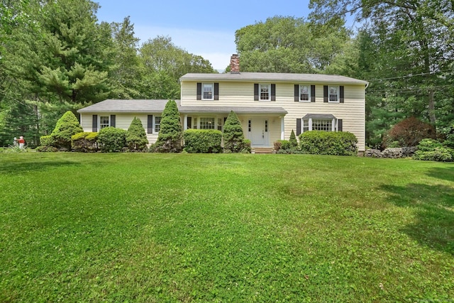27 Kitcher Ct, Trumbull, CT 06611 - colonial-style house with a chimney and a front yard