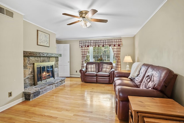 27 Kitcher Ct, Trumbull, CT 06611 - living area with ceiling fan, ornamental molding, light wood-style floors, a fireplace, and a baseboard heating unit