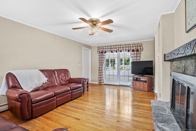 27 Kitcher Ct, Trumbull, CT 06611 - living room with light wood-style flooring, crown molding, a ceiling fan, a glass covered fireplace, and baseboards