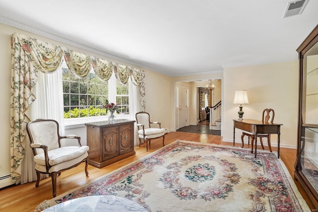 27 Kitcher Ct, Trumbull, CT 06611 - living area featuring a chandelier, ornamental molding, light wood-style flooring, and stairway