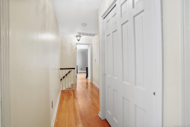 27 Kitcher Ct, Trumbull, CT 06611 - corridor featuring an upstairs landing, light wood finished floors, baseboards, and baseboard heating