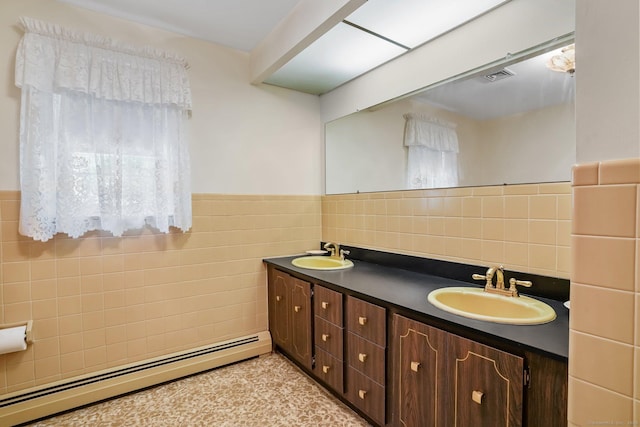 27 Kitcher Ct, Trumbull, CT 06611 - full bathroom with baseboard heating, tile walls, double vanity, wainscoting, and plenty of natural light