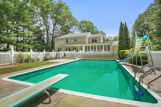 27 Kitcher Ct, Trumbull, CT 06611 - view of swimming pool featuring a water slide, a diving board, and a patio