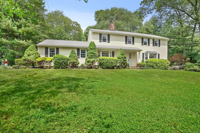 27 Kitcher Ct, Trumbull, CT 06611 - colonial inspired home featuring a chimney and a front lawn