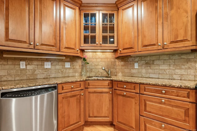 156 Governor Trumbull Way Unit 156, Trumbull, CT 06611 - kitchen with dishwasher, decorative backsplash, light stone counters, and brown cabinetry