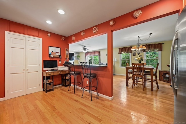156 Governor Trumbull Way Unit 156, Trumbull, CT 06611 - kitchen featuring light wood-style floors, freestanding refrigerator, a desk, a kitchen breakfast bar, and recessed lighting