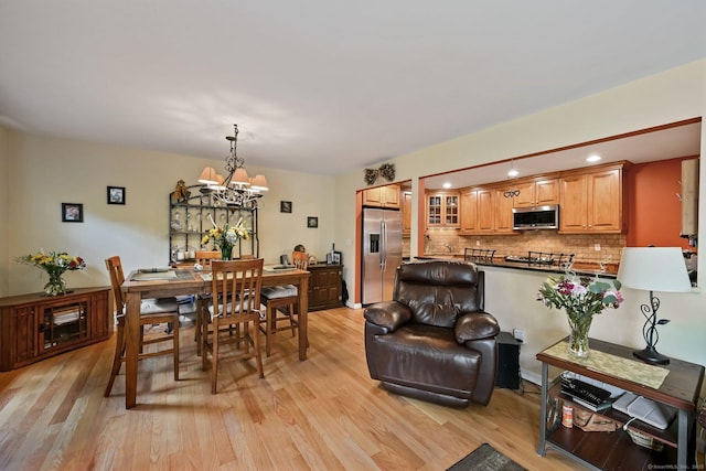 156 Governor Trumbull Way Unit 156, Trumbull, CT 06611 - dining area featuring light wood finished floors, a chandelier, and recessed lighting
