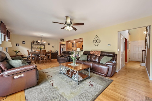 156 Governor Trumbull Way Unit 156, Trumbull, CT 06611 - living area featuring ceiling fan, a chandelier, and light wood-type flooring