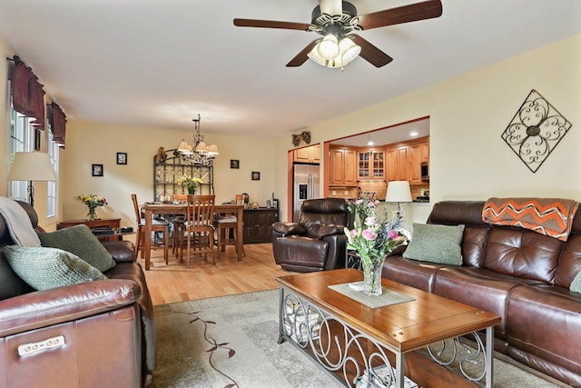 156 Governor Trumbull Way Unit 156, Trumbull, CT 06611 - living area with a chandelier, a ceiling fan, and light wood-type flooring