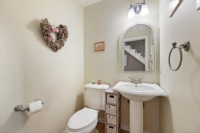 156 Governor Trumbull Way Unit 156, Trumbull, CT 06611 - half bathroom featuring toilet and wood finished floors