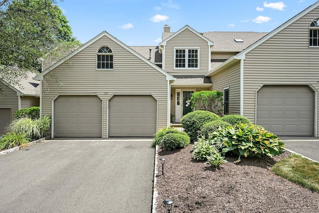 156 Governor Trumbull Way Unit 156, Trumbull, CT 06611 - traditional home with driveway, a chimney, a shingled roof, and an attached garage