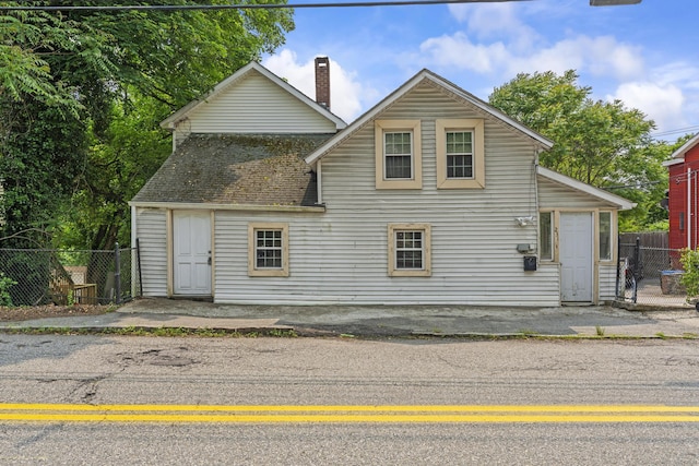 231 Broad St, Norwich, CT 06360 - back of house featuring a chimney and roof with shingles