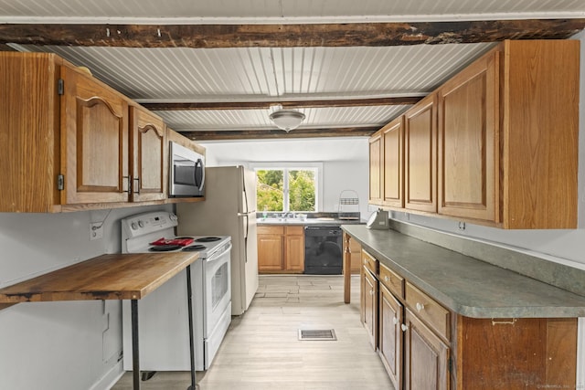 231 Broad St, Norwich, CT 06360 - kitchen with electric stove, black dishwasher, stainless steel microwave, beam ceiling, and light wood finished floors