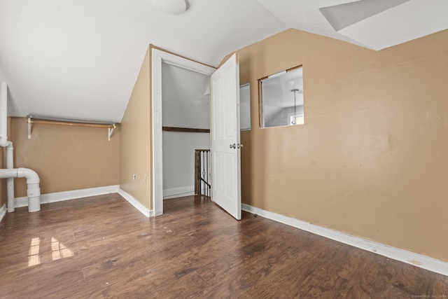231 Broad St, Norwich, CT 06360 - bonus room with vaulted ceiling, wood finished floors, and baseboards