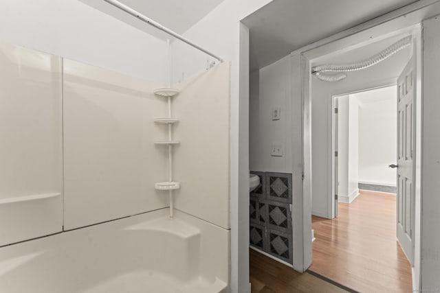 231 Broad St, Norwich, CT 06360 - bathroom with wood finished floors and shower / tub combination