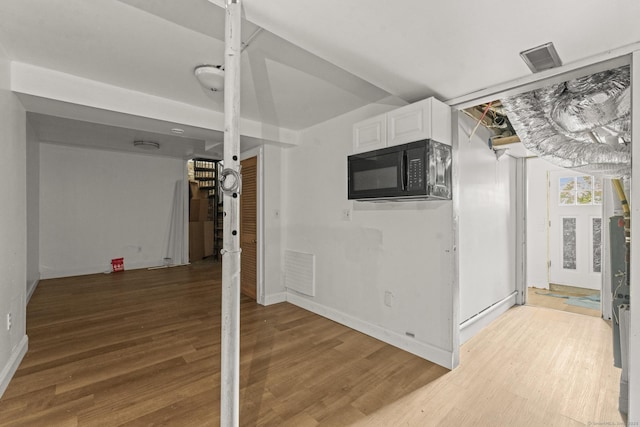 231 Broad St, Norwich, CT 06360 - basement featuring baseboards and wood finished floors