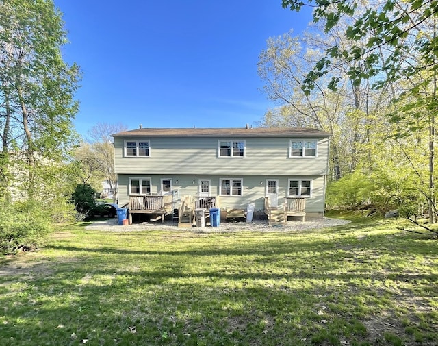 102 Caesar Dr, Bristol, CT 06010 - back of property featuring a yard and a deck