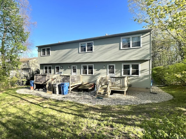 102 Caesar Dr, Bristol, CT 06010 - back of property with a lawn and a wooden deck