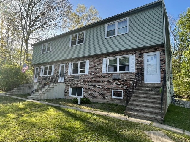 102 Caesar Dr, Bristol, CT 06010 - view of front of home with a front yard, entry steps, and brick siding