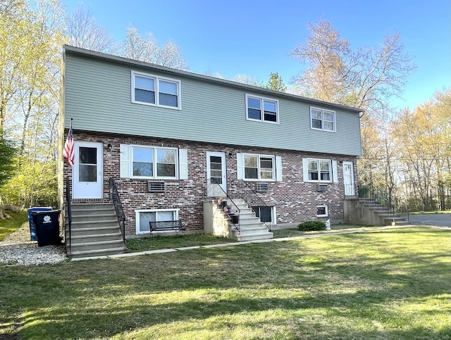 102 Caesar Dr, Bristol, CT 06010 - view of front of property with a front lawn and brick siding