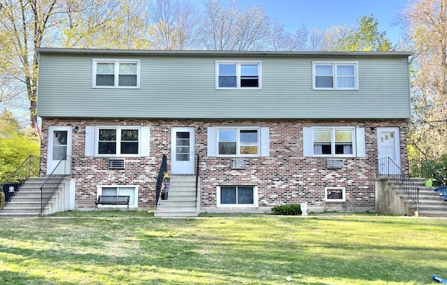 102 Caesar Dr, Bristol, CT 06010 - view of front facade featuring entry steps, brick siding, a front lawn, and stairway
