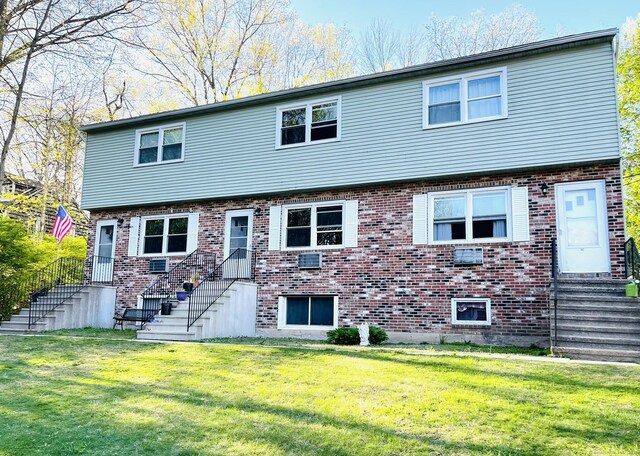102 Caesar Dr, Bristol, CT 06010 - view of front facade featuring brick siding and a front yard