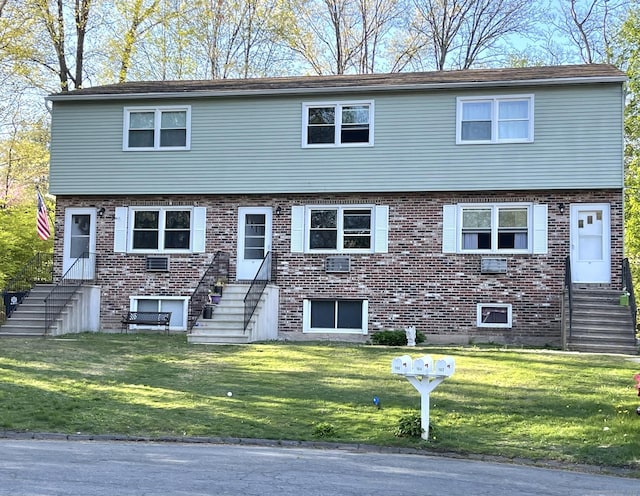 102 Caesar Dr, Bristol, CT 06010 - view of front of home with brick siding, stairway, entry steps, and a front yard
