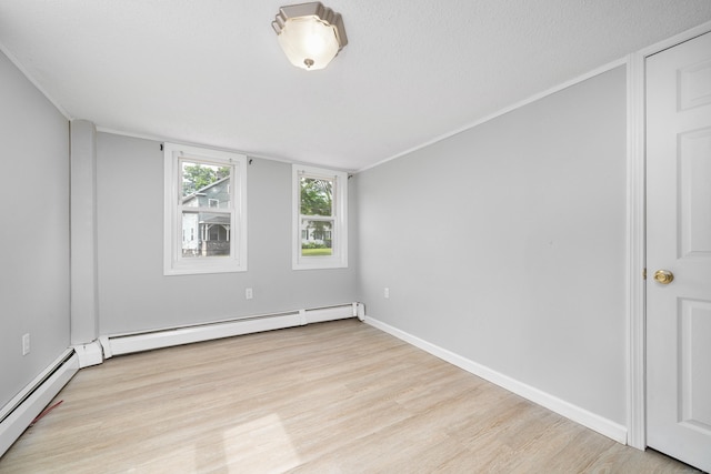74 Mill St, Middletown, CT 06457 - spare room featuring wood finished floors, a baseboard heating unit, and baseboards