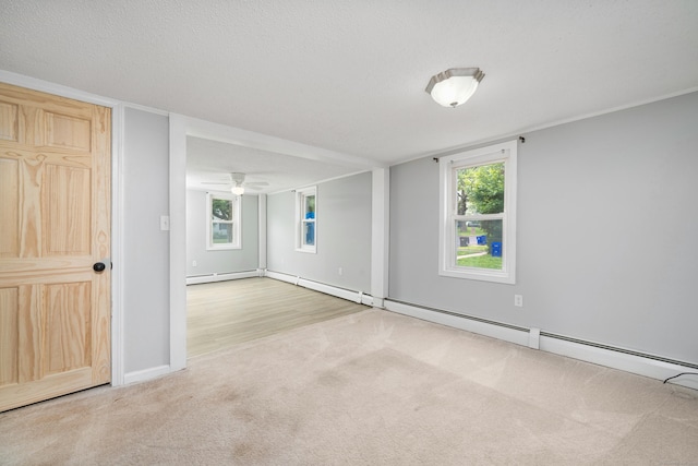 74 Mill St, Middletown, CT 06457 - carpeted spare room with ceiling fan, a baseboard radiator, and baseboards