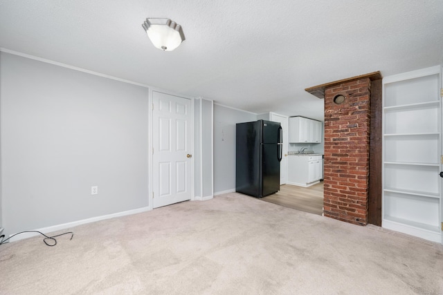 74 Mill St, Middletown, CT 06457 - unfurnished living room featuring light colored carpet, a sink, a textured ceiling, and baseboards