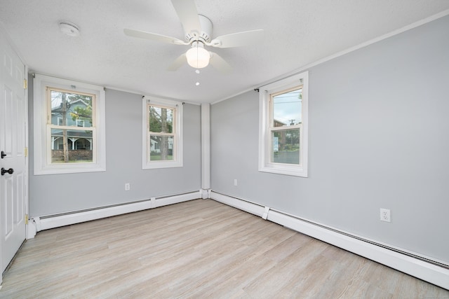 74 Mill St, Middletown, CT 06457 - spare room featuring light wood finished floors, a ceiling fan, a baseboard radiator, a smoke detector, and a textured ceiling