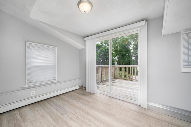 74 Mill St, Middletown, CT 06457 - unfurnished room with a baseboard radiator, wood finished floors, lofted ceiling, and a textured ceiling