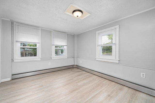 74 Mill St, Middletown, CT 06457 - empty room with a textured ceiling, wood finished floors, a baseboard heating unit, and ornamental molding
