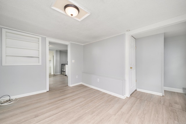 74 Mill St, Middletown, CT 06457 - spare room with wood finished floors, a textured ceiling, and baseboards